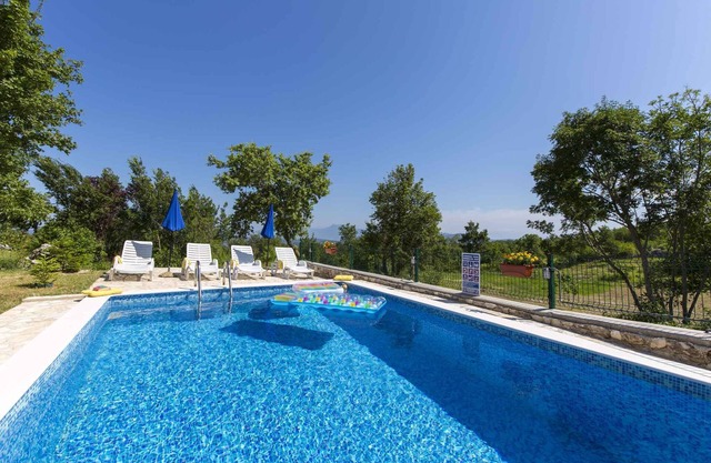 Holiday home with swimming pool surrounded by nature