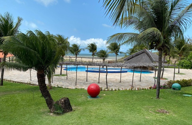 House in a gated community surrounded by green spaces 150 meters from the beach.