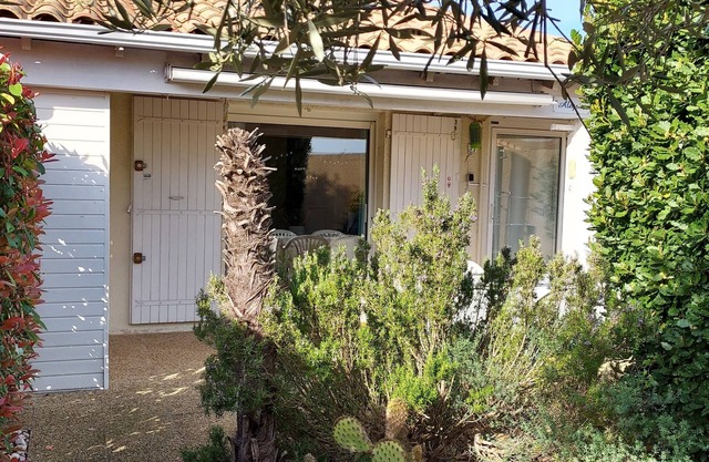 House in residence with Mediterranean garden