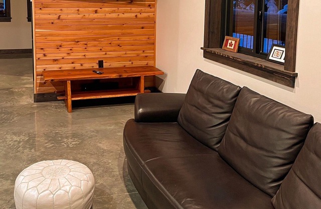 House with bridge, walk around deck, rooftop patio, 24' glass door & much more!