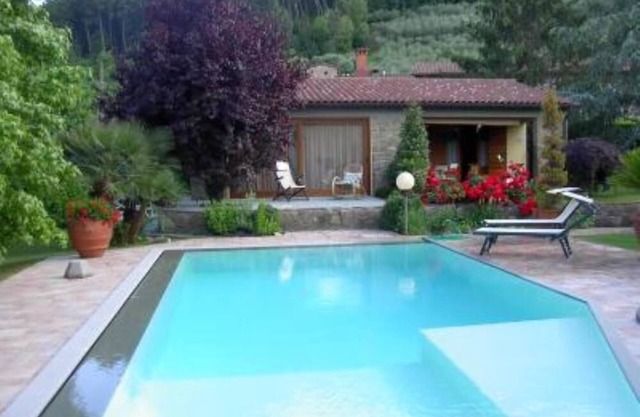 House with large veranda, garden and swimming pool