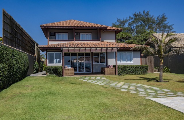 House with pool and foot in the sand