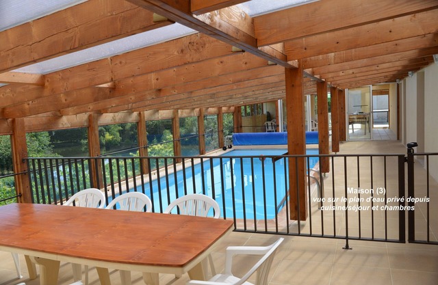 House with pool under conservatory, large terrace overlooking the private pond
