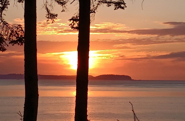 Immaculate waterfront property with westerly views of Olympics & Puget Sound