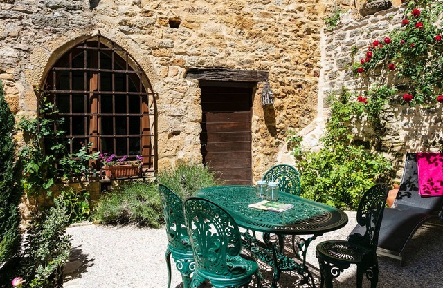 In the heart of Beynac, a rare14th century house
