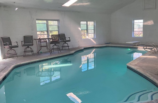 Indoor heated pool, hot tub, steam room, and pool table!