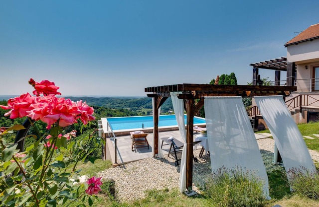 Inviting cottage on a hillside with swimming pool and spectacular views of the countryside.