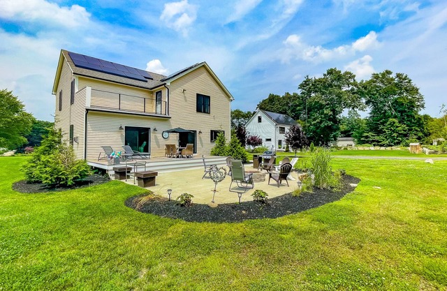Inviting house in Salisbury with EV charger, balcony, firepit, and gas grill