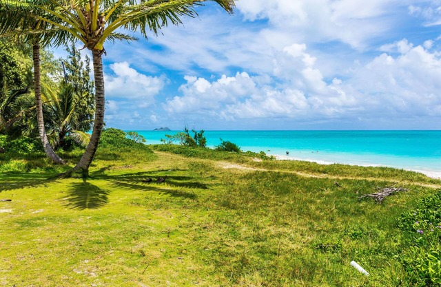 Island Beach Cottage with a deck ! Gated, Air Conditioning,steps to beach