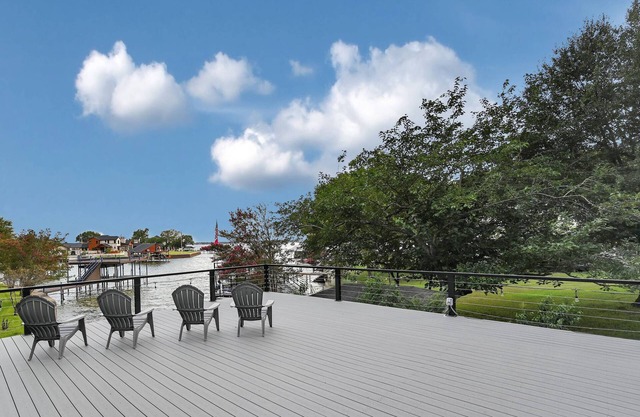 Lady of the Lake! Lake Front Property with Boathouse, Pet Friendly, Hot Tub, & Outdoor Sitting Area
