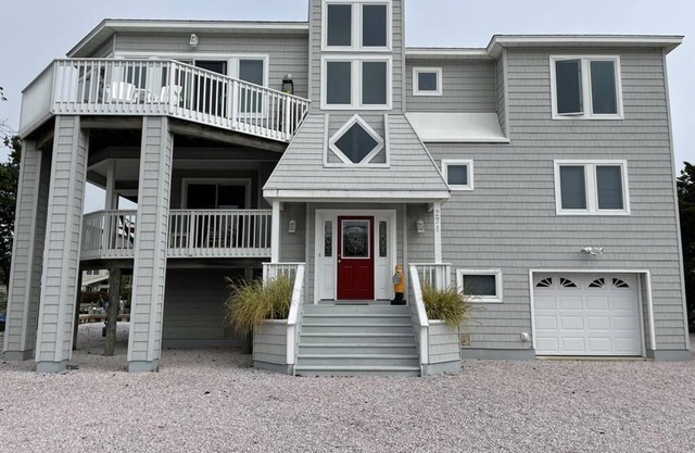 Lagoon front. Loveladies. Dock. Decks. Beach Badges. Bikes. Ping Pong table.