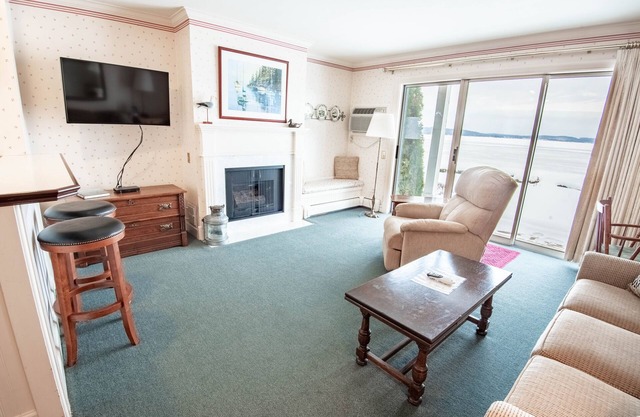 Lake Charlevoix at Your Door | Ground-Level Balcony Escape | Private Beach