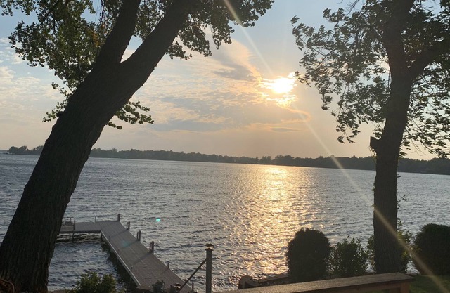 Lake Darling Lake House on 300' of frontage with private sand beach and firepit.