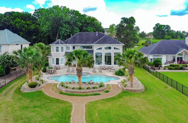 Lake Front Luxury Estate featuring a swimming pool and hot tub on Lake Conroe!