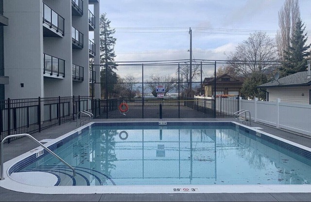 Lake Okanagan brand new beach condo with AC, heated outdoor pool, patio and BBQ.