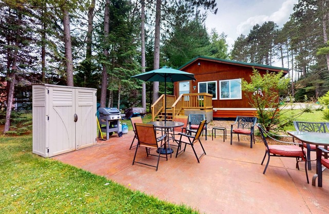 Lakefront cottage w/a dock, shared furnished patio, firepit, & a paddleboat