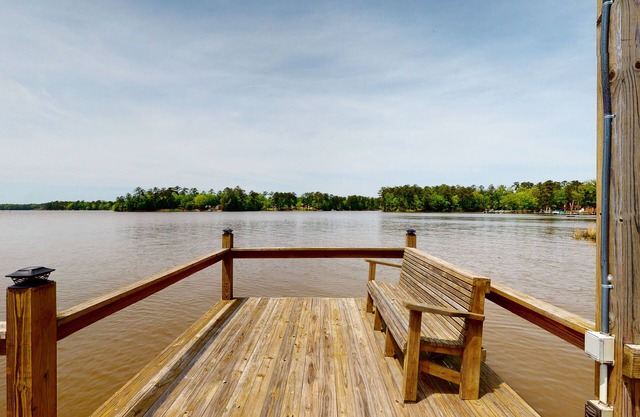 Lakefront home with incredible sunset view, private dock, screened porch, and AC