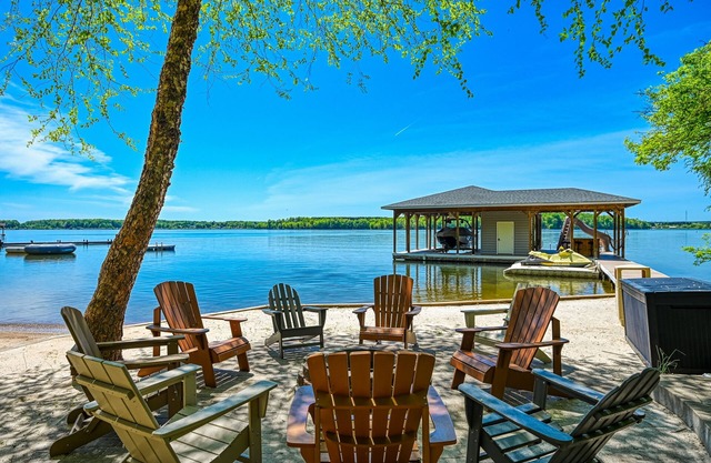 Lakefront home with views, private hot tub, central AC, dock & waterslide
