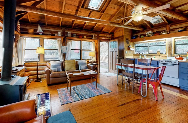 Lakefront log cabin with wrap-around deck, grill, wood stove & new kitchen