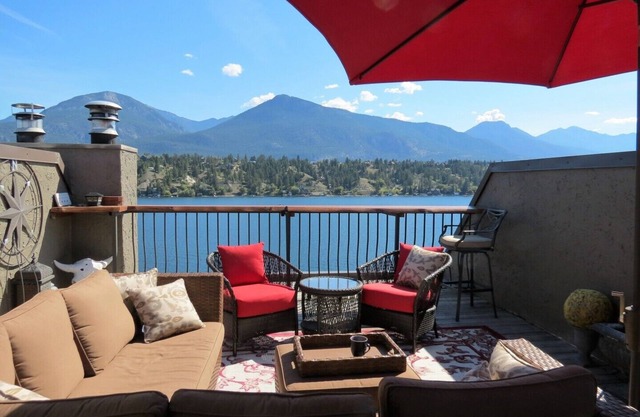 Lakefront townhome with outstanding mountain, and lake views and private deck