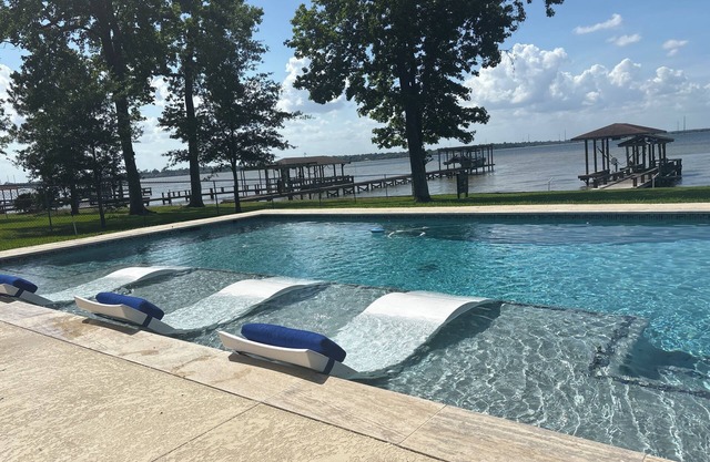 Lakehouse…Pool and Hottub. Waterfront property with boat dock.