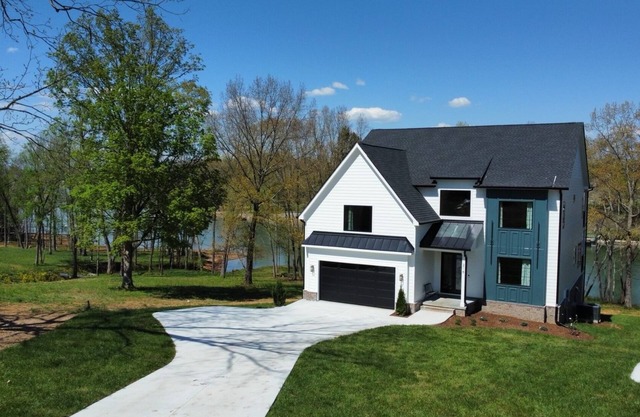 Lakeshore Modern! Lake front with platform dock and 2 kayaks, firepit and views
