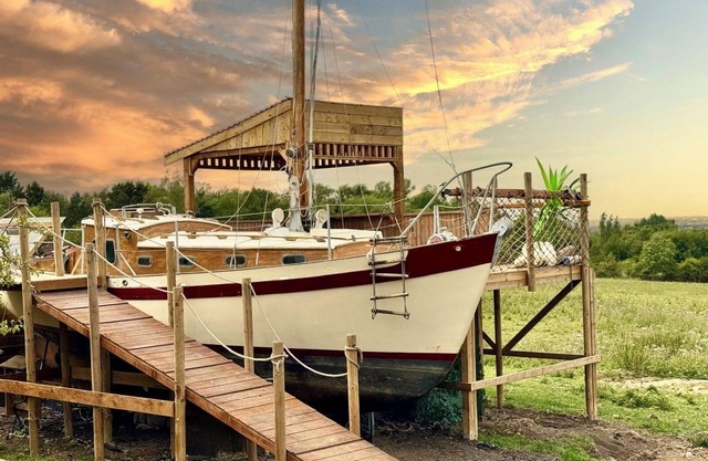 Land Ahoy! A historic boat, anchored in acres of greenery. 1 of a kind adventure