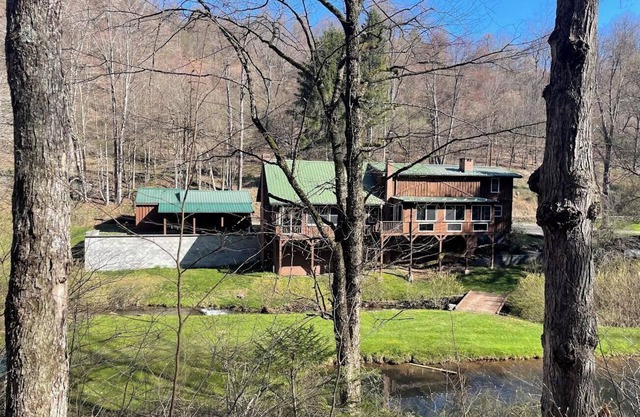 Large family mountain retreat on Buck Run with a stocked pond in Leetonia Pa.