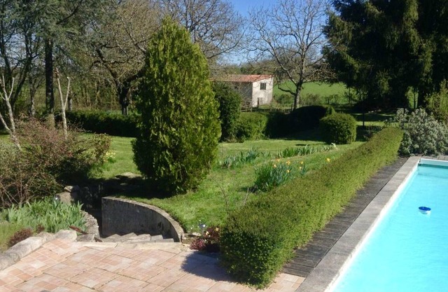 Large house over two floors with pool and gardens.