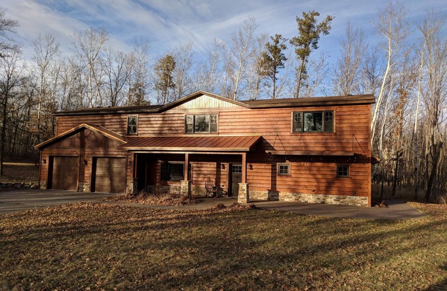Large lake front cabin, has 2 kitchens and comes with a pontoon! Bring the fam!