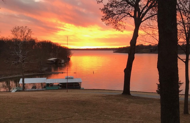 Large private acreage, very open space, decks, hot tub, treehouse, dock, more.