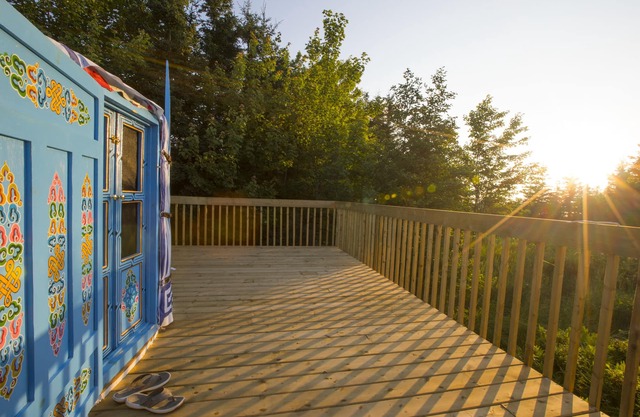 Large sky blue yurt at Cabot Shores Wilderness Resort