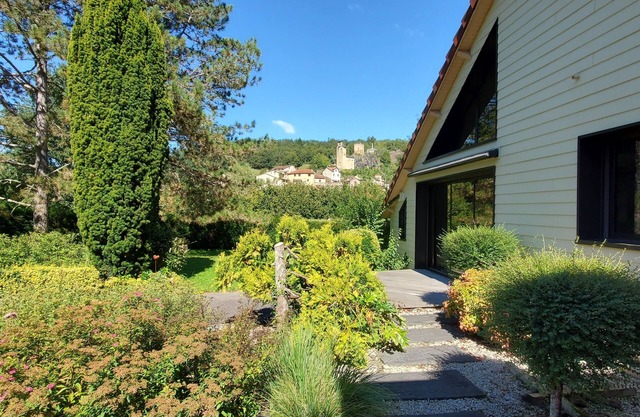 Large upscale house, swimming pool and wooded grounds, view of Fort d'Aubin