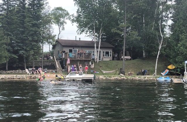 Little Long Lake lakefront cottage with its own beach and private drive.