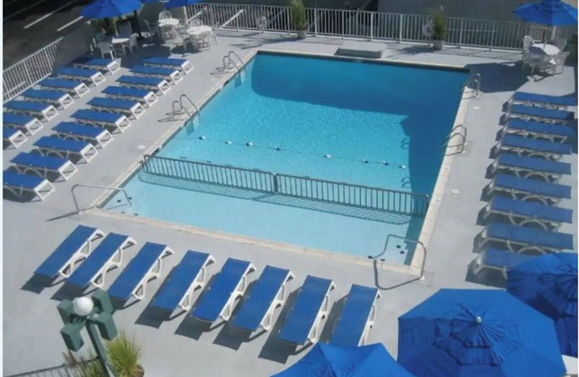 Location Location! 1 block to the beach w/Heated Pool, private bedroom/kitchen