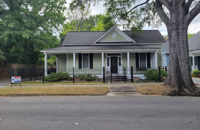 Lovely fenced and gated 3-bed/2 bath home on beautiful Elm lined Main Street.