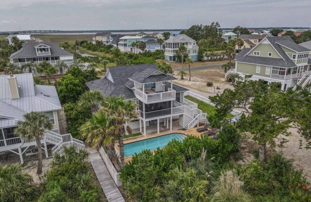 Lovely home with boardwalk beach access, water views, saltwater pool