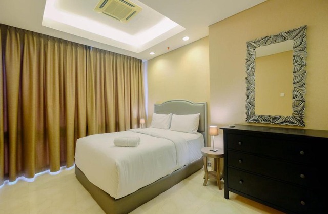 Luxurious 2BR at The Masterpiece Condominium Epicentrum Apartment By Travelio