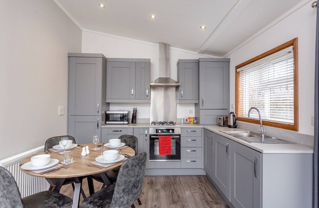 Luxurious lodge with one double bedroom and one twin bedroom.