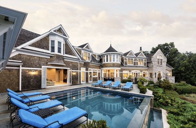 Luxury home with infinity pool overlooking Lake Michigan, outside turf play area