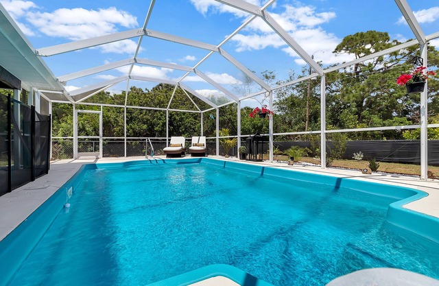 Luxury Oasis - heated & gated pool, relaxing modern home sleeps 8. Best location