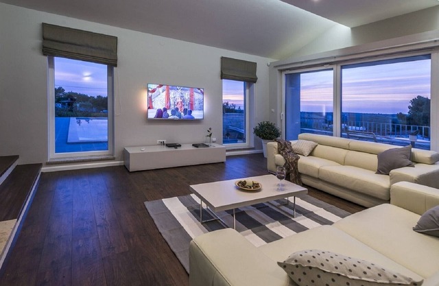 Luxury villa with infinity swimming pool, outdoor jacuzzi and garden