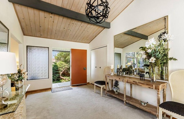 Mid-Century home with beautiful views, deck, & rear fenced-in patio