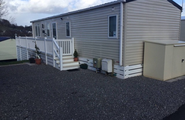 Modern 2 bed caravan with surrounding decking and patio; sleeps up to 6 people