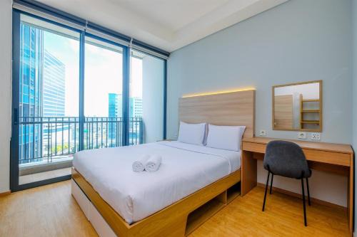 Modern and New 1BR across LRT Station Samara Suites Apartment By Travelio
