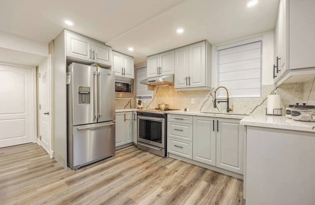 Modern Basement Oasis: Kitchen, Bed, Bath!