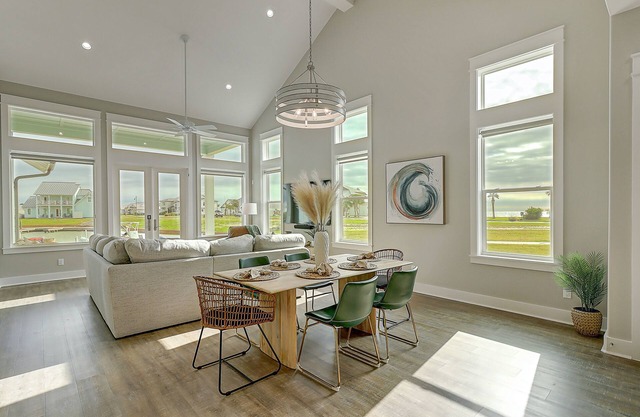 Modern bayfront home with private dock & access to a pool & firepit