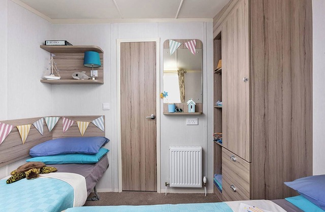 Modern caravan with one double and two twins.