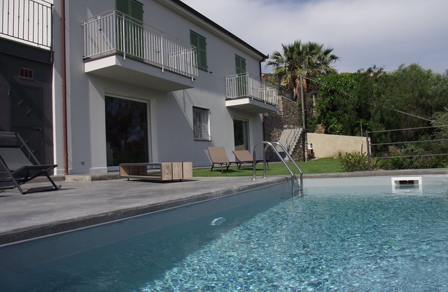 Modern elegant villa private pool terrace overlooking the sea and mountains