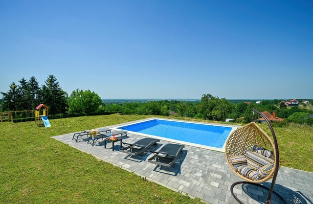 Modern home with pool and view